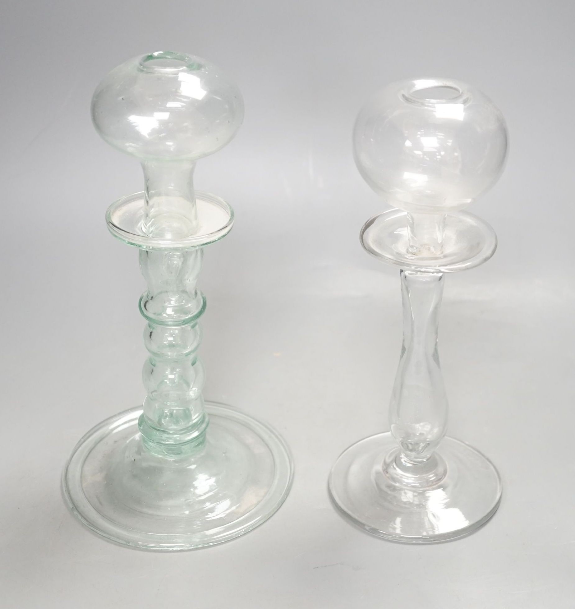 Two 19th century glass lacemaker's lamps, 25cm